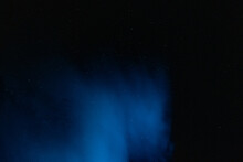 A Ghostly Cloud Of Campfire Smoke Floats Through A Night Sky