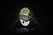 © Elijah Hurwitz - Silhouette of man running across stones in dark cave in Bronson Canyon, Los Feliz, Los Angeles