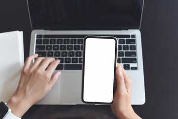 Sticker - mockup image of blank white screen mobile phone, business woman using smartphone and working on laptop computer