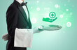 © ra2 studio - Handsome young waiter in tuxedo holding healthcare icons on tray