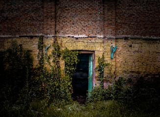  Abandoned Building with a cyan opened door