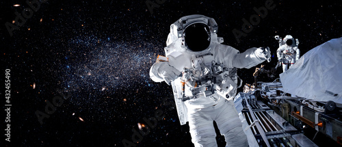 Astronaut spaceman do spacewalk while working for space station in outer space . Astronaut wear full spacesuit for space operation . Elements of this image furnished by NASA space astronaut photos.
