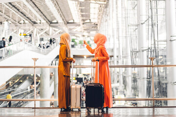 Wall Mural - Two young beauty islamic asian arabic muslim woman wearing a hijab enjoying shopping and having fun talking together in the shop at fashion store