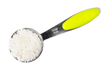 coconut flakes in measuring spoon cutout on white