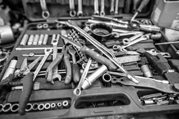 Pliers and wrenches on the table in the garage.