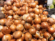 Onions On Supermarket Vegetable Shelf