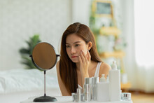 Asian Young Woman Looking In Mirror Worry About Pores Facial Skin Problem With Acne And Dry Skin,Skin Care Concept