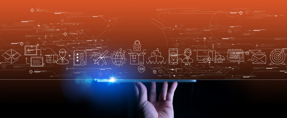 Leinwandbilder - Businesswoman hand using Digital tablet computer of global logistics network distribution and transportation Ui, Smart logistics, Innovation future of transport on dark orange background.