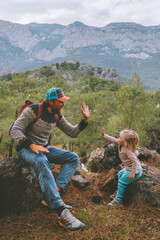 Wall Mural - Family travel father and daughter baby high five hands hiking in mountains together summer vacations adventure healthy lifestyle outdoor Lycian way in Turkey