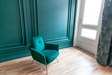 Beautiful Luxury Classic Blue Green Clean Interior Room In Classic Style With Green Soft Armchair. Vintage Antique Blue-green Chair Standing Beside Emerald Wall. Minimalist Home Design.