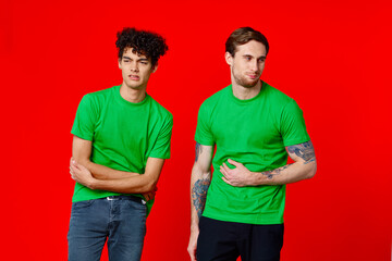 two man holding his neck emotions discontent red background