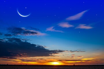 Wall Mural - crescent moon with beautiful sunset background . bright sky . sunset in hot summers, nature backgrou