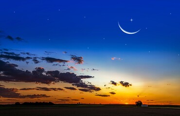 Wall Mural - crescent moon with beautiful sunset background . bright sky . sunset in hot summers, nature backgrou