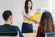 Young Asian woman graduate hand shake with two manager to welcome before start to job interview with positive motion in meeting room,Business Hiring new member,Job interview first impressions concept