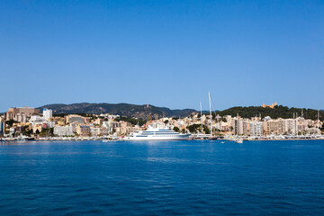 Wall Mural - View of the bay of Palma de Mallorca with luxury yachts, buildings, mountains.