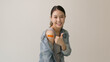 © ChayTee - Young attractive beautiful asia female or teenage receive covid-19 anti virus vaccine in campaign vaccination safe life happy smile cheerful with blue, yellow, pink bandage on arm with copy space.