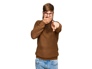 Canvas Print - Young irish redhead man wearing casual clothes and glasses laughing at you, pointing finger to the camera with hand over mouth, shame expression