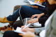 © maxbelchenko - Young audience sitting in a row and making notes while listening to presentation at conference hall. Business group meeting seminar training concept. Planning, analysis, collaborate work in teamwork.