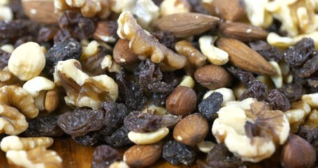 Wall Mural - Slider shot of healthy gourmet trail mix with nuts and raisins close up