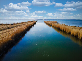 Closeup shot of a beautiful seascape with two land wings in the water on a sunny day