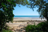 Fototapeta Sawanna - Casuarina Beach view through foliage, Darwin, Northern Territory, Australia.