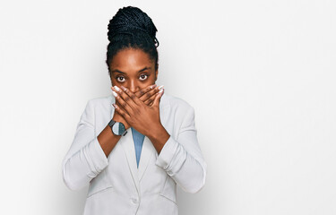 Canvas Print - Young african american woman wearing business clothes shocked covering mouth with hands for mistake. secret concept.