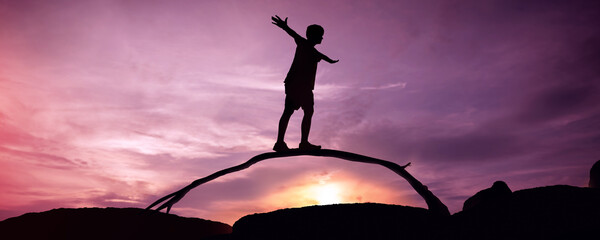 Work Life Balance Concept. Silhouette of Person Balancing Body to Crossing tree branch.Twilight Scenery on Beach or Moutain. Balancing Body, Mind, Soul and Spirit. Mental Meditation Practice