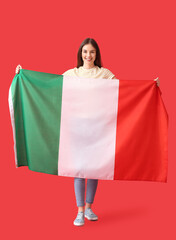 Wall Mural - Beautiful young woman with Italian flag on color background