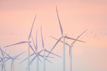 wind turbines on sunset