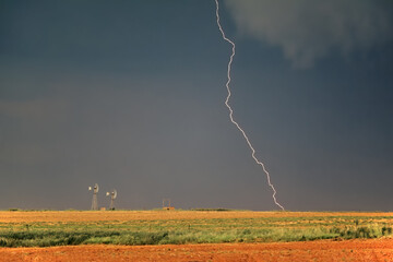 Poster - Rural landscape with an approaching thunderstorm and lightning - South Africa.