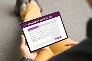 man submitting trademark application online
