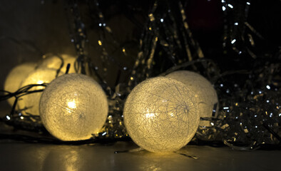 Sticker - Closeup shot of a Christmas tree decoration with white lamps