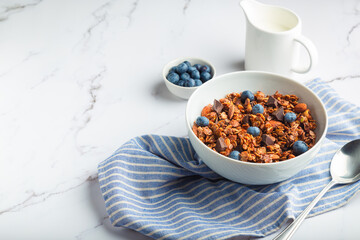 Wall Mural - Homemade granola, muesli with pieces of dark chocolate, nuts and blueberries