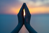 Fototapeta Miasto - Women's hands in the blue purple sunset as a symbol of yoga or religion, namaste silhouette