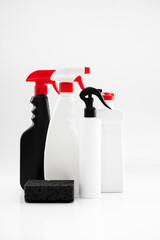 set of household chemicals for cleaning on a white background. washcloth, gloves, bottles with detergents close-up. mockup