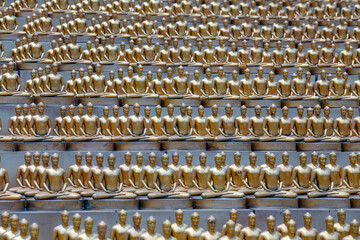 Wall Mural - Million golden Buddha figurine in Wat Phra Dhammakaya. Buddhist temple, Bangkok, Thailand