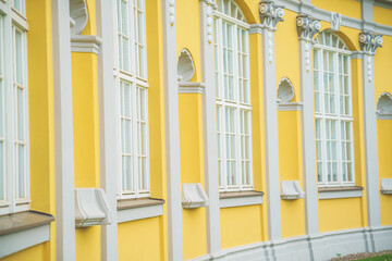 Facade of an old gallery with showcases and windows