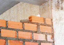 Brick Orange Wall Install Laying Inside Room Partition In Construction Site