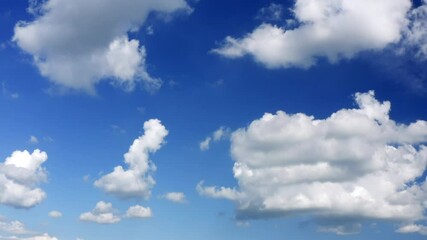 Wall Mural - Stunning view of a blue sky with some fluffy clouds. Aerial shoot, sliding movement. Natural background with copy space.