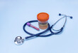 © Irina - a stethoscope, a can of urine and a test tube of blood for analysis on a blue background