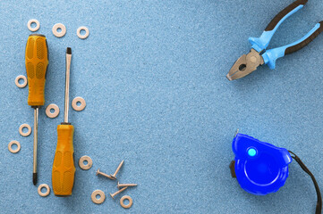 Men's work. The repair tools are on the table. The concept of housework, workshop.