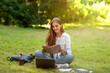 © Prostock-studio - Beautiful Teen Girl Reading Book In Park, Preparing For High-School Lessons Outdoors