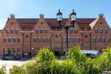 Wall Mural -  Polish Baltic F. Chopin Philharmonic in Gdansk is a concert hall located on Olowianka island on the Motlawa river.