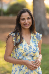 Outdoor headshots of beautiful Asian Indian woman. 