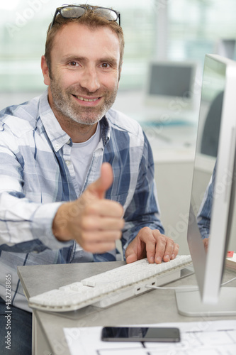 system administration technician showing thumbs up