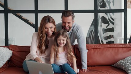 Sticker - Happy young family bonding together while using laptop at home