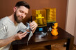 © phoenix021 - Man assembling finished figurine from 3d printer