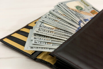 us dollar into dark leather wallet