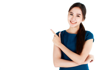 Close-up portrait of pretty woman wearing casual business dress, pointing index finger up to copy space and happy expression by smiling wide opened mouth. Advertising concept.