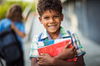 © liderina - Two school boys outside. Boy looking at camera and holding book. Focus is on foreground.  I love school.